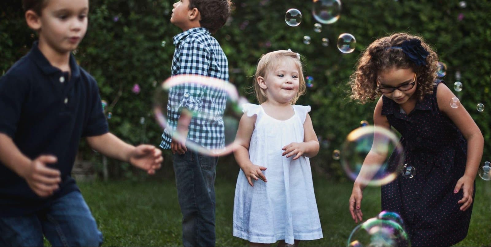 Children making friends and playing at nursery