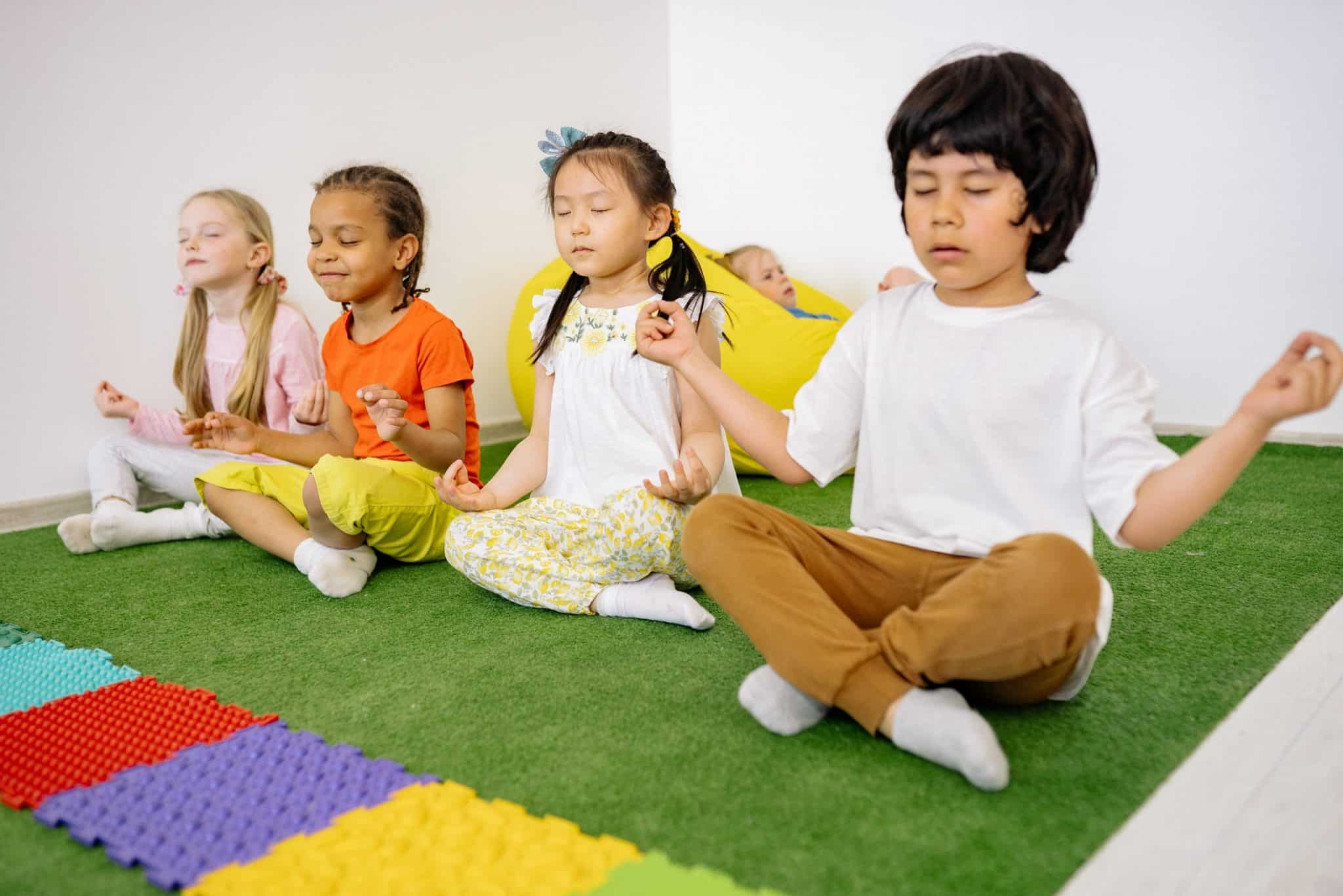 Toddlers doing yoga at nursery
