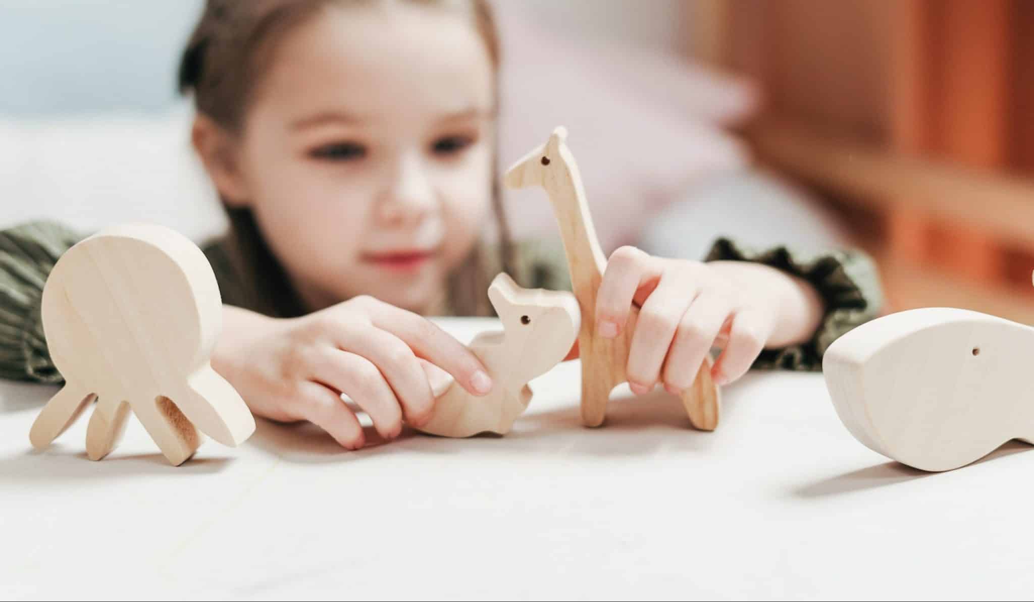 Toddler imaginative play - girl playing with toys